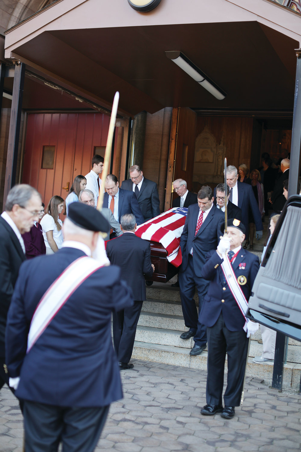 Knights of Columbus salute Bishop Roque as he leaves the Cathedral for the final time.